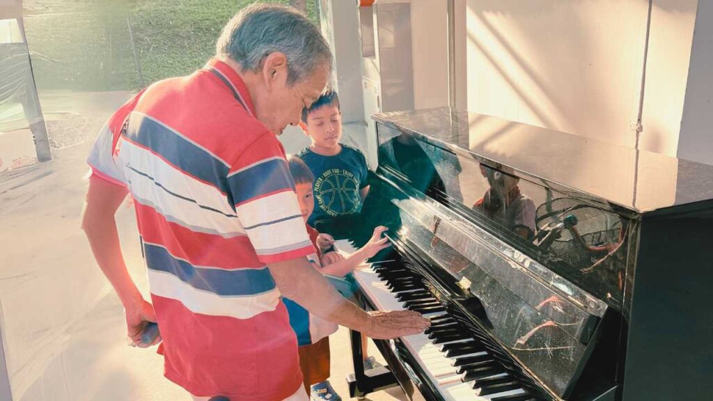 Adults taking piano lessons in Singapore